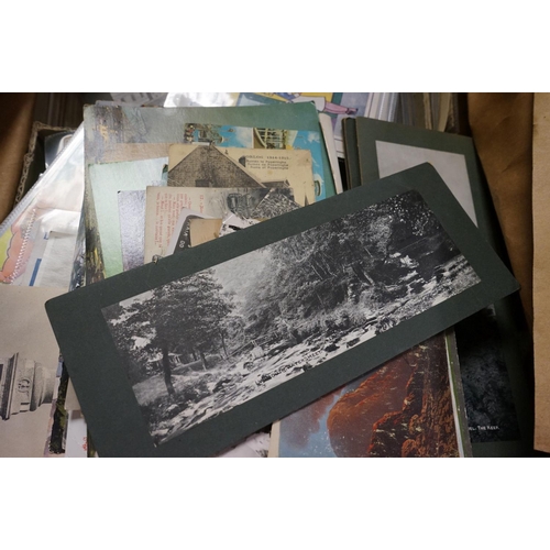 556 - A large collection of mixed ephemera contained within three boxes to include Postcards, press photog... 