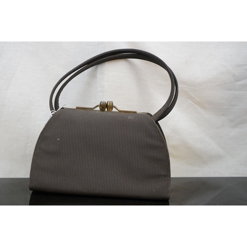 560 - Group of designer handbags and clutch bags, to include Finnigans of Bond Street & Mappin and Webb