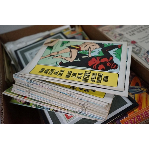 564 - A large collection of mixed ephemera contained within two boxes to include comics, postcards and tea... 