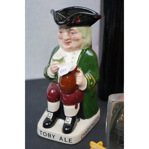 571 - A box of mixed collectables to include breweriana, cigarette cards, toby jug and commemorative ware.