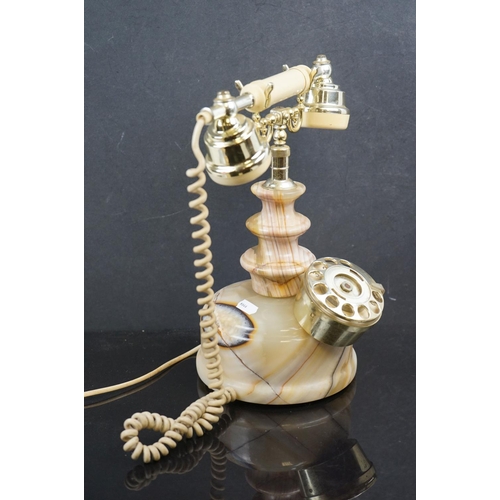 573 - A vintage style dial up telephone with onyx base.