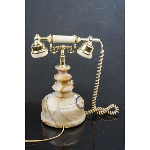 573 - A vintage style dial up telephone with onyx base.