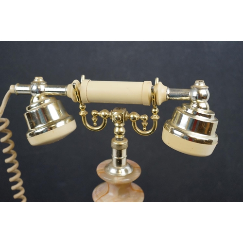 573 - A vintage style dial up telephone with onyx base.