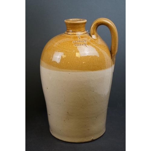 579 - A collection of four stoneware bottles to include two Bath advertising examples.