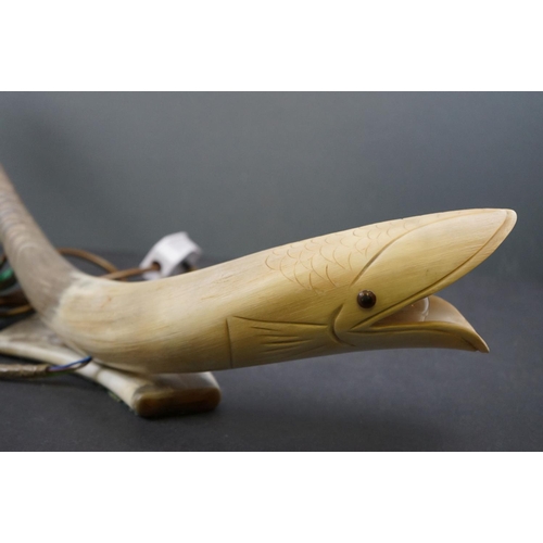 585 - An unusual carved horn table lamp in the form of a fish.