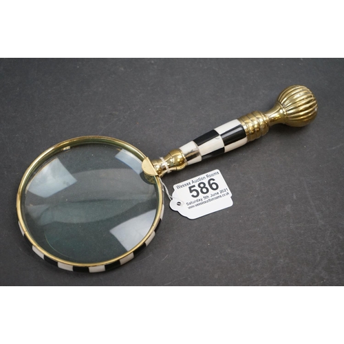 586 - Large handheld magnifying glass with checkerboard handle