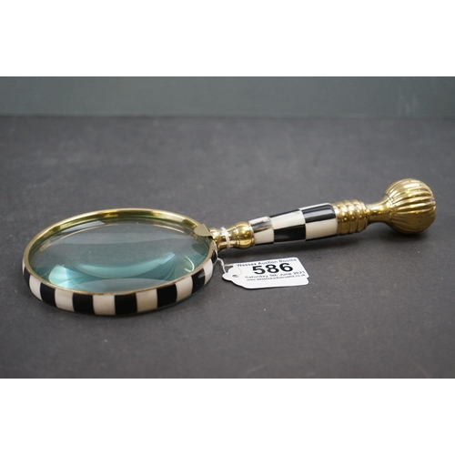 586 - Large handheld magnifying glass with checkerboard handle