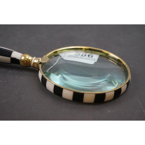 586 - Large handheld magnifying glass with checkerboard handle