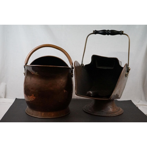 590 - Two antique copper coal scuttles together with a shovel.