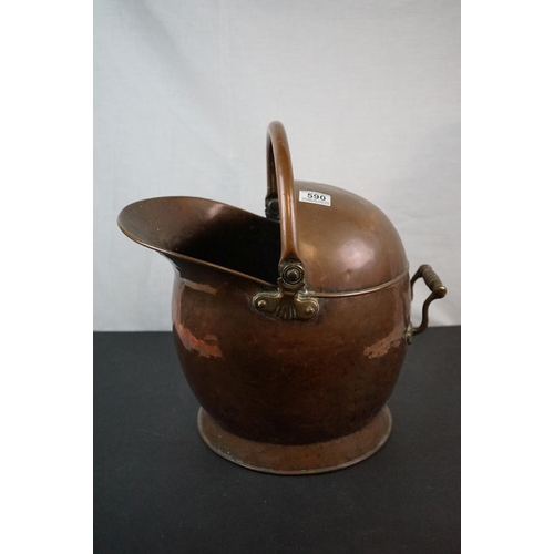 590 - Two antique copper coal scuttles together with a shovel.