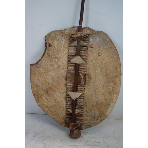 593 - An antique Zulu shield with integral knobkerry together with spear.