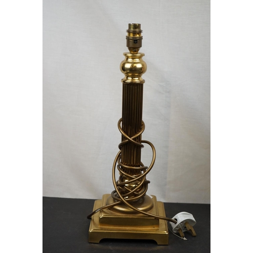 594 - Three brass table lamps to include a brass Corinthian Column and a cherub example together with a br... 