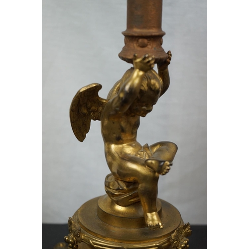 594 - Three brass table lamps to include a brass Corinthian Column and a cherub example together with a br... 