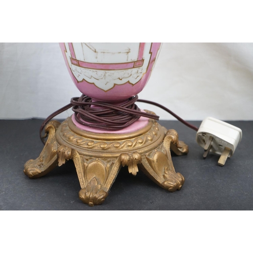 594 - Three brass table lamps to include a brass Corinthian Column and a cherub example together with a br... 