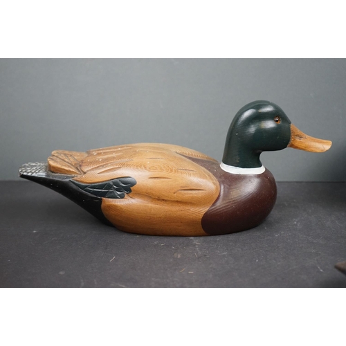 601 - A collection of wooden decorative Duck ornaments.