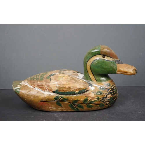 601 - A collection of wooden decorative Duck ornaments.