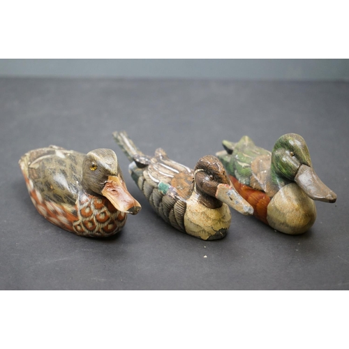 601 - A collection of wooden decorative Duck ornaments.