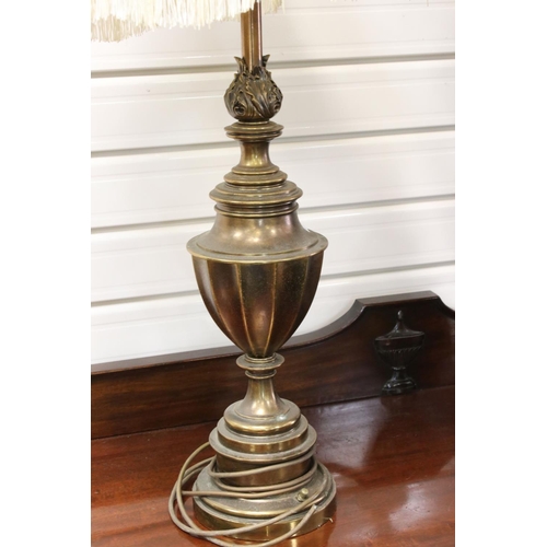 110 - A pair of mid 20th century brass antique style lamps with shades.