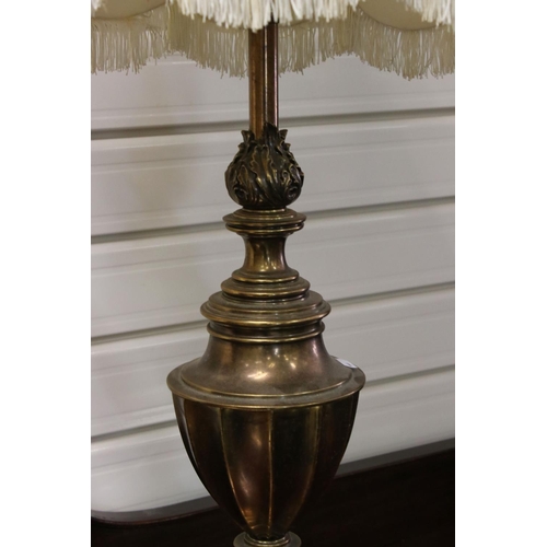 110 - A pair of mid 20th century brass antique style lamps with shades.