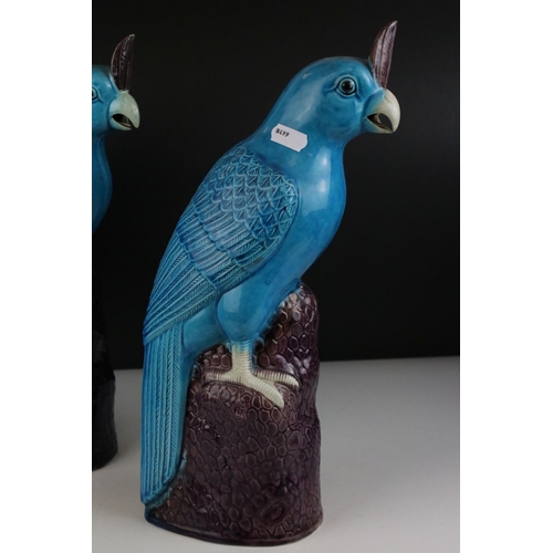 139 - Two Turquoise / Blue Glazed Chinese style Parrots, impressed numbers to base, 35cms high together wi... 