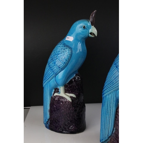 139 - Two Turquoise / Blue Glazed Chinese style Parrots, impressed numbers to base, 35cms high together wi... 