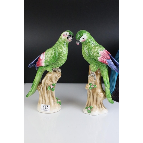 139 - Two Turquoise / Blue Glazed Chinese style Parrots, impressed numbers to base, 35cms high together wi... 