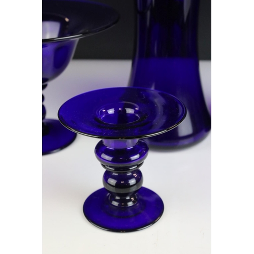 142 - Four items of Bristol Blue Glass including Two Vases, Footed Bowl and a Candle Holder, all etched Br... 