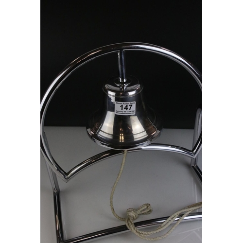 147 - Art Deco White Metal Bell fixed onto a Stand, 38cms high