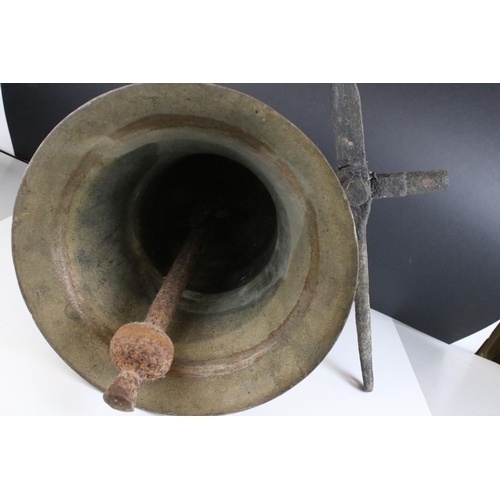 151 - Large Antique Bronze / Bell Metal Bell with Clanger and held on a cast iron bracket, bell 30cms high