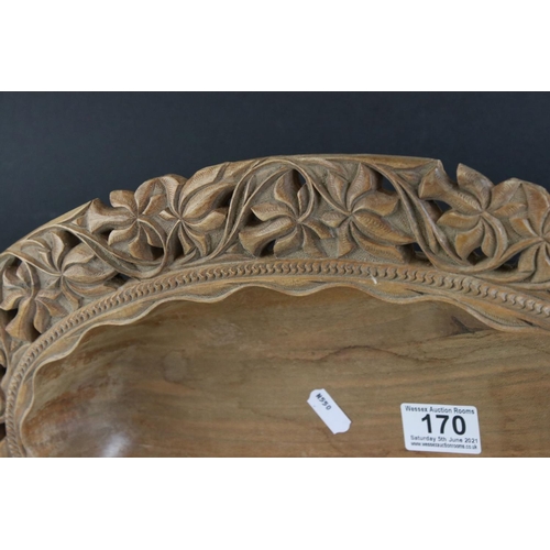 170 - Black Forest style Hardwood Bowl with floral and foliate pierced and carved decoration, 46cms long