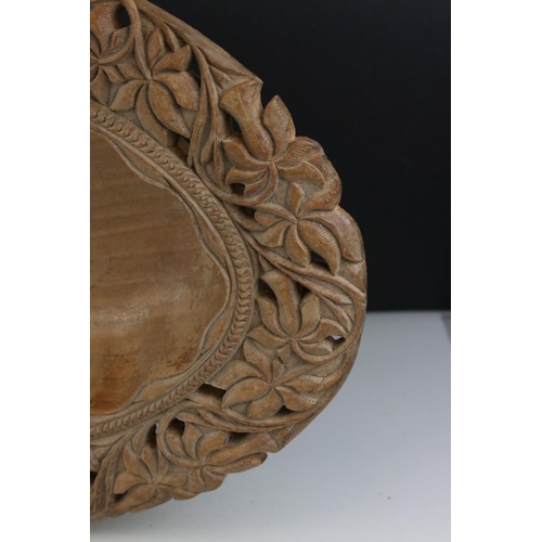 170 - Black Forest style Hardwood Bowl with floral and foliate pierced and carved decoration, 46cms long