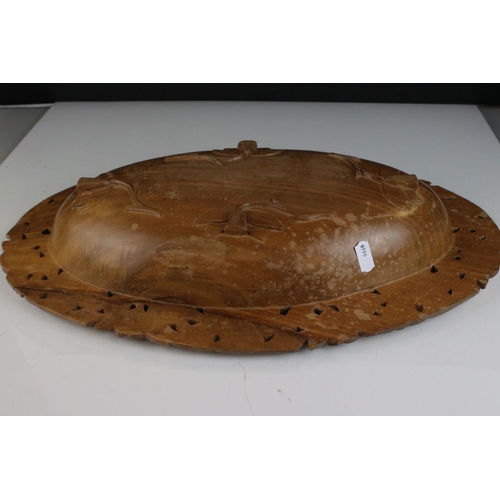 170 - Black Forest style Hardwood Bowl with floral and foliate pierced and carved decoration, 46cms long