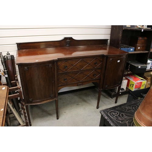 703 - Regency style Mahogany Sideboard with two central drawers flanked by two bow fronted cupboards (one ... 