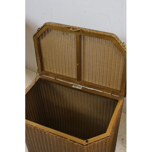 711 - Lloyd Loom Lusty Gold Linen Basket together with Two Loom gold finished Tub Chairs