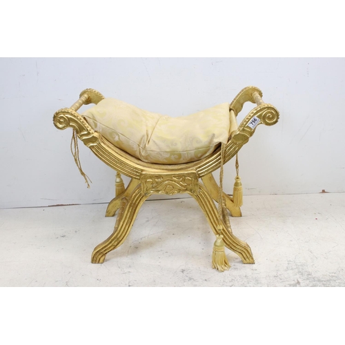 756 - Regncy style X Frame Stool, with gold finish and gold fabric cushion, 74cms wide x 58cms high