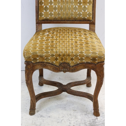 771 - A mustard upholstered antique walnut hall chair with carved shell decocoration.