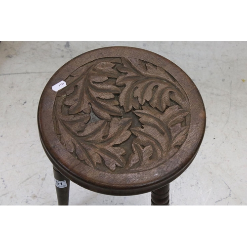 791 - Early 20th century Oak Circular Three Legged Stool with carved leaf decoration, 28cms wide x 34cms h... 