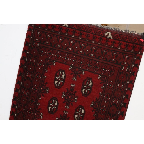 826 - Eastern Red Ground Wool Hand Knotted Runner Rug, 76cms x 280cms