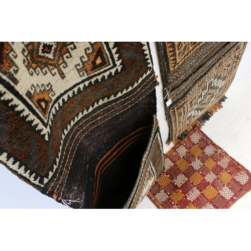 827 - Two Afghanistan Wool Double Carpet Camel Bags, 108cms x 46cms and 122cms x 50cms together with a Per... 