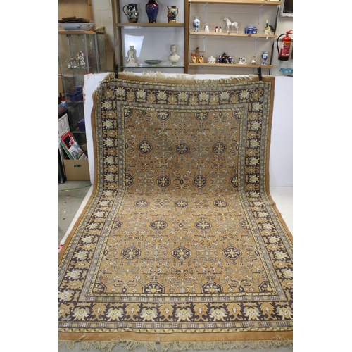 832 - Large Orange, Blue and Purple Ground Rug with stylised pattern to central panel surrounded by floral... 