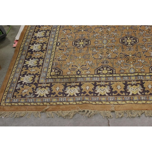 832 - Large Orange, Blue and Purple Ground Rug with stylised pattern to central panel surrounded by floral... 