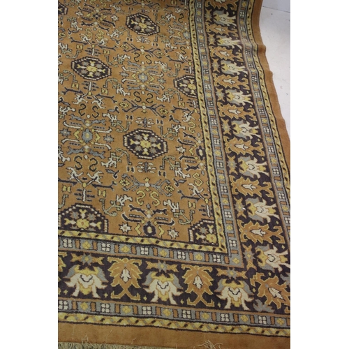 832 - Large Orange, Blue and Purple Ground Rug with stylised pattern to central panel surrounded by floral... 