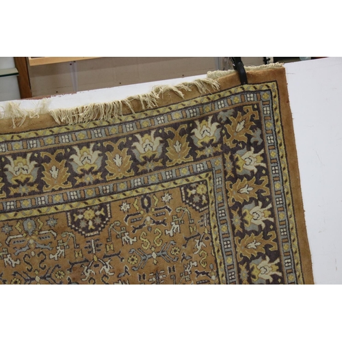 832 - Large Orange, Blue and Purple Ground Rug with stylised pattern to central panel surrounded by floral... 