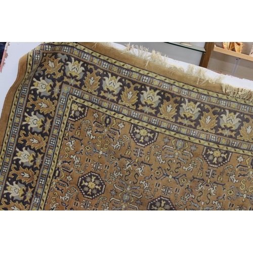 832 - Large Orange, Blue and Purple Ground Rug with stylised pattern to central panel surrounded by floral... 