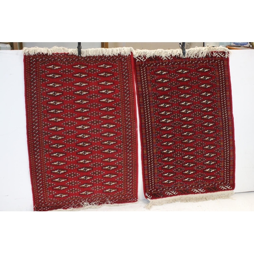 833 - Pair of Red Ground Bokhara style Wool Rugs, 121cms x 81cms