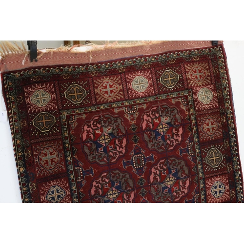 834 - Dark Red Ground Wool Rug with Geometric Pattern to centre surrounded by a border of square panels, 1... 