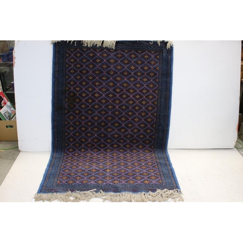 837 - Blue Ground Wool Rug with Diamond pattern, 193cms x 126cms