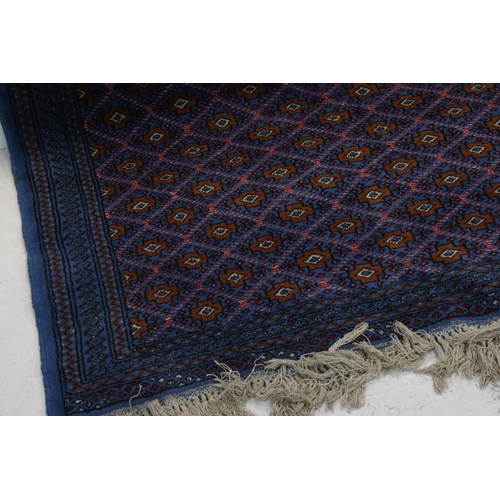 837 - Blue Ground Wool Rug with Diamond pattern, 193cms x 126cms