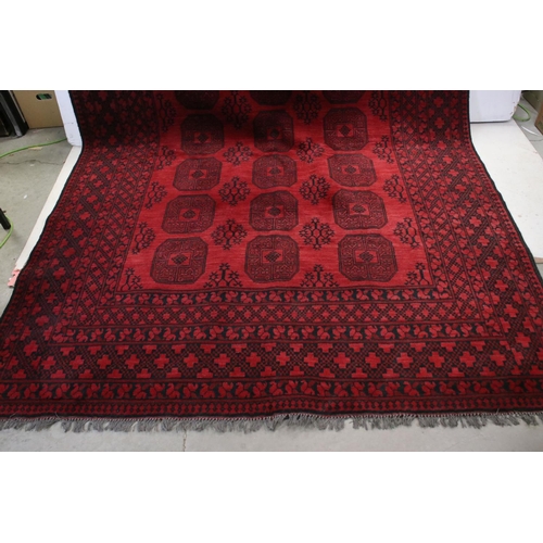 839 - Large Afghanistan Hand Knotted Wool Red Ground Rug with Black Geometric Pattern Panel surrounded by ... 