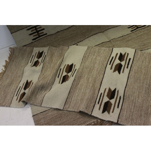 841 - Two Beige and Cream Wool Rugs with stylised pattern, 225cms x 163cms and 147cms x 65cms